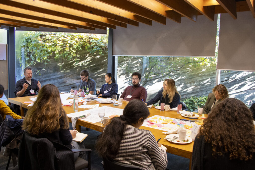 Students and Andrew MacDougall having conversations. 