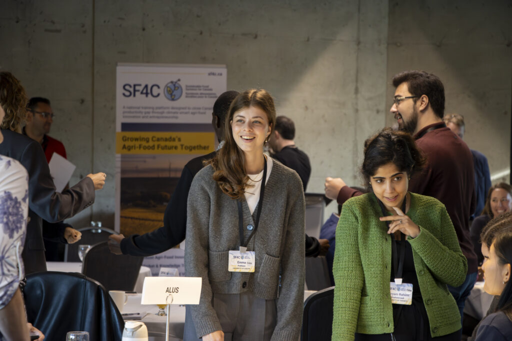 Students at the Innoveat Ontario hackathon discuss their solution at an ALUS table while working on a biodiversity outcomes challenge through the CARE program, highlighting experiential learning in real-world agri-food innovation.